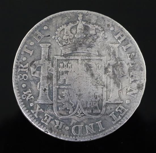 A rare George III octagonal countermarked silver dollar, crisp countermark on a fairly worn 8 Reales coin.